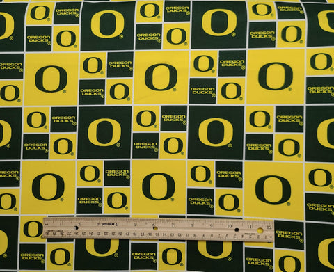 Sykel Enterprises Fabrique Innovations OR020 - University of Oregon Logo Fabric / Green, Yellow, White Logo Block Print