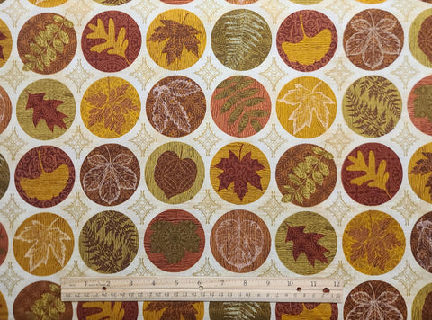 Harvest Reflections 33657-79 - Cream Fabric with Gold Crosshatch / Gold, Green, Red, Brown Leaf Badges Print