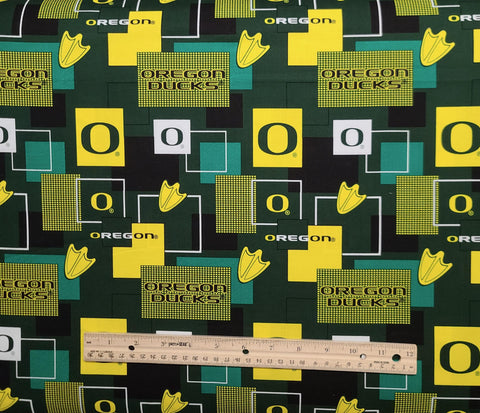Sykel Enterprises Fabrique Innovations OR1115 - University of Oregon Logo Fabric / Green, White, Yellow Logo Block Print