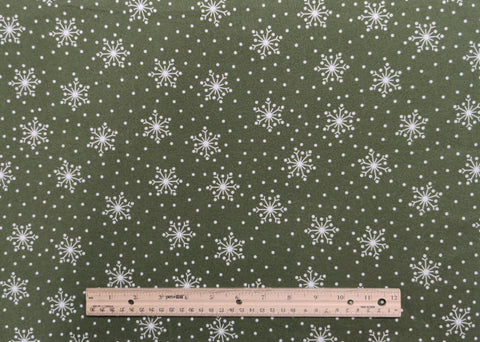Crazy for Christmas 18182 Maywood Studio Bonnie Sullivan - Dark Green Tonal Flannel Fabric / Tossed White Snowflake and Dot Print