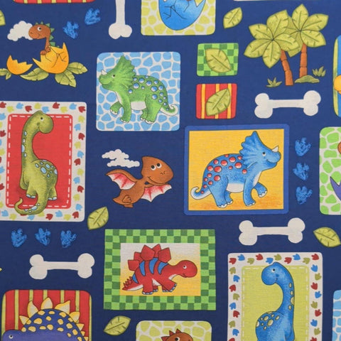 Blank Quilting 6780 2013 - Navy Fabric / Red, Green, Yellow Cartoon Baby Dino Block Print