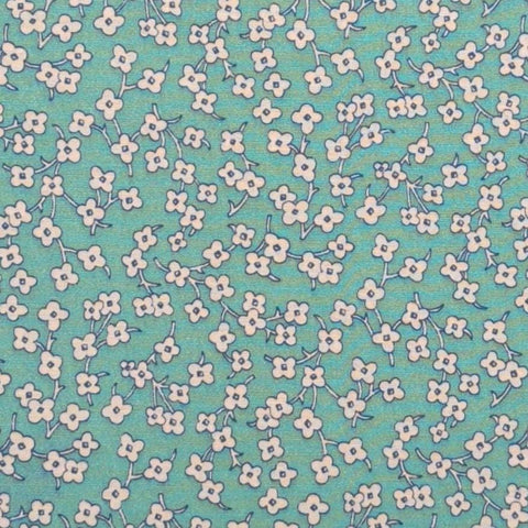 Marcus Brothers Textiles - Turquoise Fabric / White Flower Print