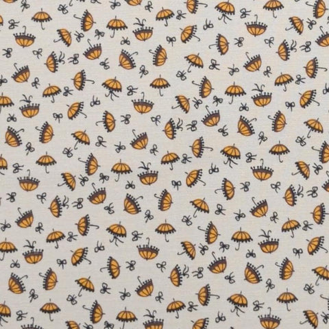 Aunt Grace Sweeties by Judie Rothermel for Marcus Brothers Textiles - White Fabric / Yellow, Brown, Black Tossed Umbrella, Bow Print