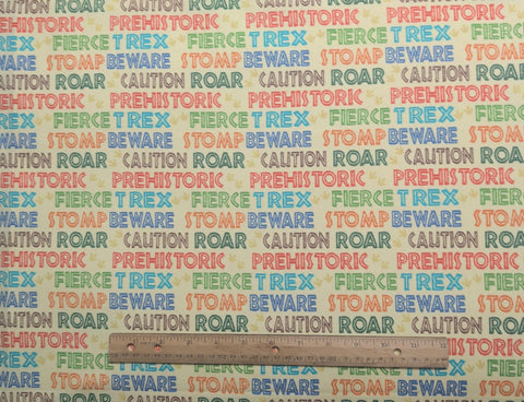 Gordano Studios - Pale Yellow Fabric / Multi-Colored Dinosaur Script Print