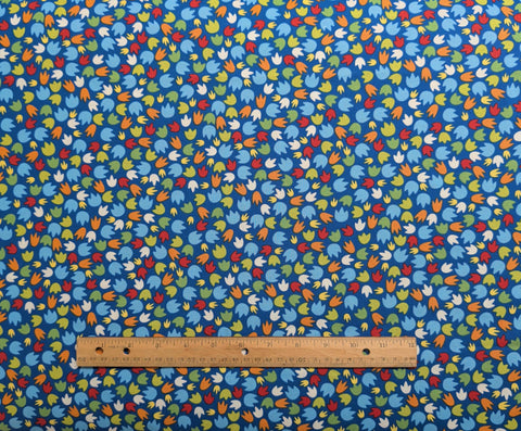 Dandy Dinos - Aarolynn Weiderhold for Wilmington Prints - Blue Fabric / Green, Orange, White, Light Blue Tossed Paw Prints
