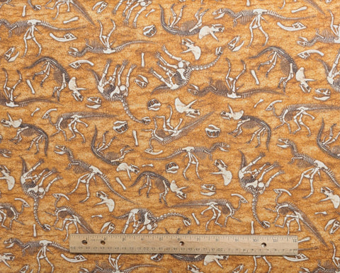 Dan Morris Design 2015 for Quilting Treasures - Golden Tan Tonal Fabric / Cream, Brown, Tan Tossed Dinosaur Skeletons Print