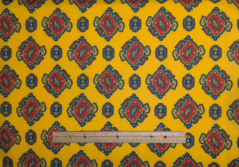 Marcus Bros Textiles - Yellow Fabric / Red, Blue, Green Paisley Medallion Print